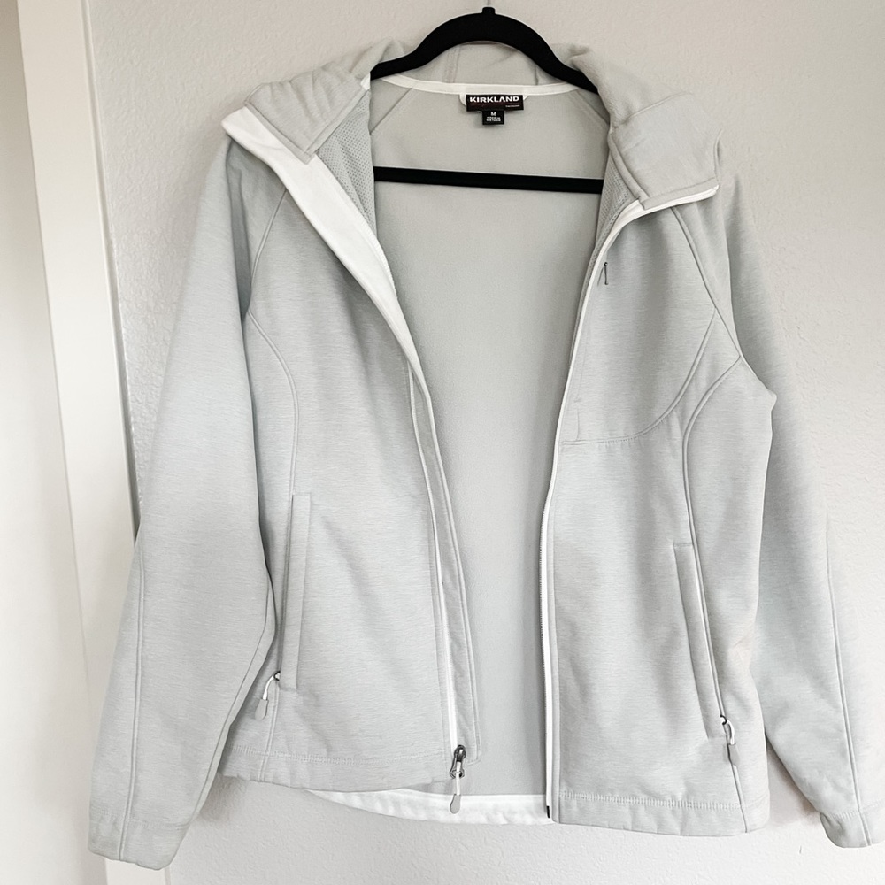 Light gray short rain jacket with hood